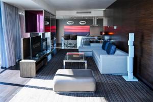 a living room with a couch and a table at Palms Place Hotel and Spa in Las Vegas