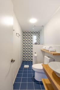 a bathroom with a toilet and a sink at Guadalupe Inn in Mexico City +51 photos