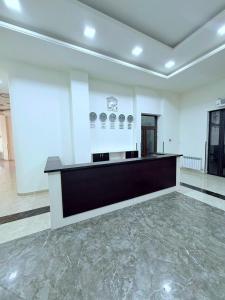 a large white room with a counter in the middle at Republic square LUXURY with balcony in Yerevan