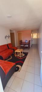 a living room with a couch and a table at Bello Amanecer in Guanajuato