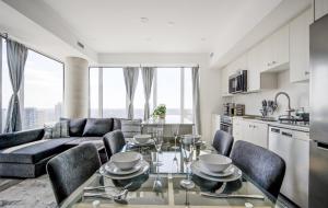 a kitchen and living room with a table and chairs at Open concept with city views in Kitchener