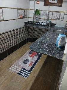 a kitchen with a counter top and a sink at Malika nubian house in Aswan