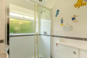 a bathroom with a shower with a glass door at 2 Bed in Brixham oc-57244 in Brixham +21 photos