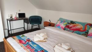 a bedroom with a bed with a dinosaur bedspread at Birken Loft am Meer in Neustadt am Rübenberge