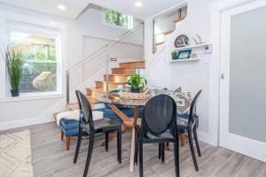 a dining room with a table and chairs at Cozy Duplex Near T in Boston