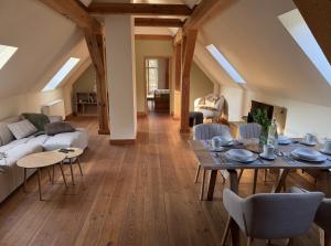 a living room with a couch and a table at Forsthaus Boberow in Rheinsberg