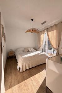 a bedroom with a large bed and a large window at Entire house 6 guests Mountain view in Luri