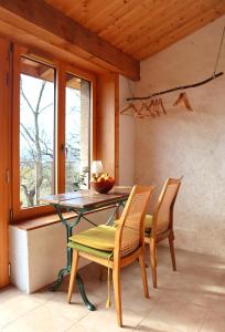 a dining room with a table and chairs at La Forge - calme absolu avec vue sur les Pyrenées in Villarzel-du-Razès