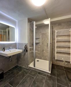a bathroom with a shower and a sink at Hearts Home Hahnenklee in Hahnenklee-Bockswiese +34 photos