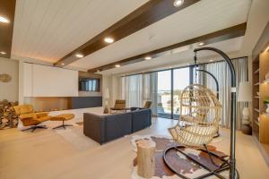 a living room with a couch and a chair at Stylish Open Concept Suite in Central KW in Kitchener