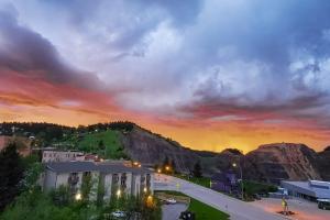 a view of a city with a sunset at Addie House in Lead