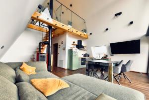 a living room with a couch and a table at Villa Perush in Vuzenica