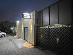 a building with a sign on the side of it at Garden Villa 4, Ajman in Ajman  +22 photos