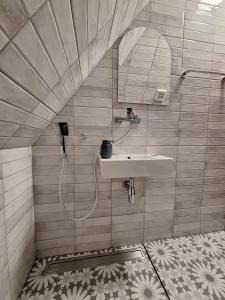 a bathroom with a sink and a mirror at Митровилица - Mitrovilica in Mitrovac +38 photos
