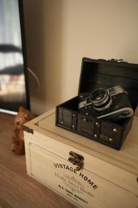 a camera sitting on top of a wooden box at Vintage Apartman Gyula in Gyula +19 photos