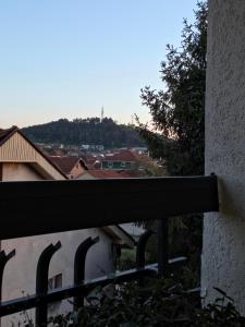 a view of a city from a balcony at Sense Loft in Leskovac