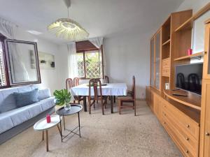 a living room with a couch and a table at Apartamento El Hayedo 20808 in Argoños