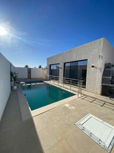 a swimming pool in the backyard of a house at Villa SAM in Fafou