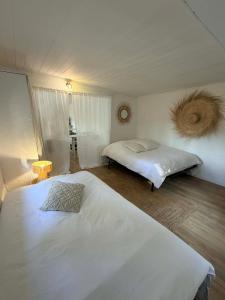 a bedroom with two beds in a room at Caseddu Corse - Maison Typique in Cauro