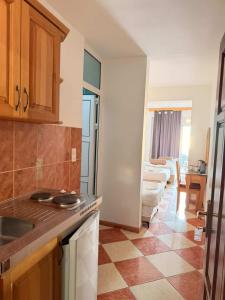 a kitchen with a sink and a stove top oven at Wiena Apartments in Ulcinj +93 photos