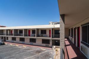an empty parking lot in front of a building at Central Phoenix Hotel in Phoenix