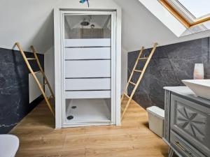 a bathroom with a closet with a mirror at La Maison des Jeux in Saint-Maur +46 photos