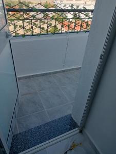 a view from the inside of a door with a window at Modern and Calm Apartment in Mahdia near Beach in Rejiche