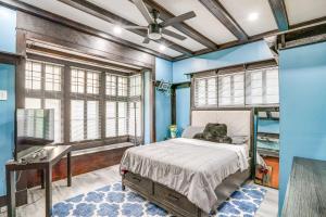 a bedroom with a bed and a sink and a tub at Walkable Schenectady Getaway: 2-Unit Campus Hub in Schenectady
