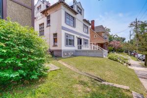a large white house with a large yard at Walkable Schenectady Getaway: 2-Unit Campus Hub in Schenectady