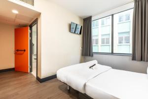 a hospital room with a bed and a window at easyHotel Liverpool in Liverpool