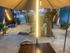 an umbrella sitting on top of a wooden table at Sea Breeze Lodge in Siquijor