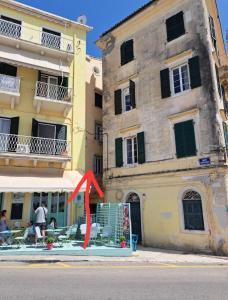 a red arrow in front of a building at Deppy's Two-storey House in Corfu