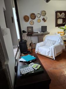a living room with a couch and a table at Home Near the Clouds - Refúgio in Nordeste +21 photos