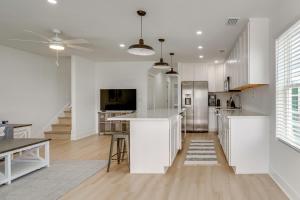 a kitchen with white cabinets and a kitchen island at Brand New Home in Steinhatchee with Rooftop Deck! in Jena +17 photos