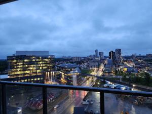 a view of a city skyline at night at Stylish Open Concept Condo with Gym in Kitchener