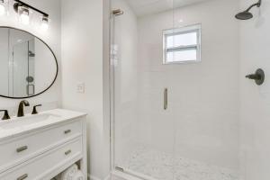 a white bathroom with a shower and a sink at Brand New Home in Steinhatchee with Rooftop Deck! in Jena