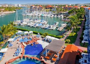 an aerial view of a pool at a marina at El Cid Marina Beach Hotel in Mazatlán