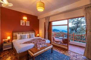 a bedroom with a bed and a large window at PACK Shimla in Shimla +96 photos