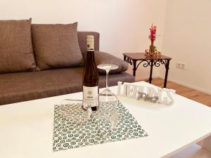 a bottle of wine sitting on a table at Ferienwohnung Moselverliebt in Schweich
