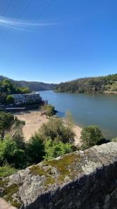 a view of a body of water with a beach at Relaxing House in Lever +16 photos