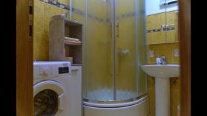 a bathroom with a washing machine and a sink at Epicenter Apartments Split in Split +133 photos