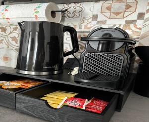 a tea kettle sitting on top of a table at B&b la bessolina in Ivrea