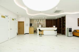an office with a desk in the middle of a room at A25 Premium Hotel - 36 Giang Văn Minh in Hanoi