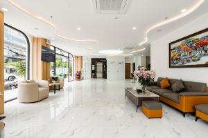 a lobby with a couch and a table in a building at A25 Premium Hotel - 36 Giang Văn Minh in Hanoi +81 photos