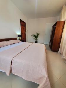 a bedroom with a large bed in a room at Faraja Homestay Mwanza in Mwanza