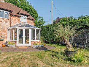 a greenhouse in the garden of a house at 1 Bed in Lymington oc-92403 in Ripley +10 photos