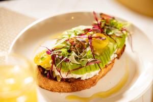 a piece of bread with a salad on a plate at Hotel Dax in Addison