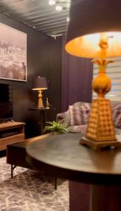 a living room with a chess board on a table at L'Industriel in Drummondville