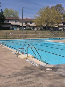an empty swimming pool with a ramp in the middle at Modern/Retro Condo in High Point