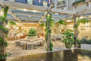 a lobby of a hotel with a fountain and tables at Paris Las Vegas Hotel & Casino in Las Vegas
